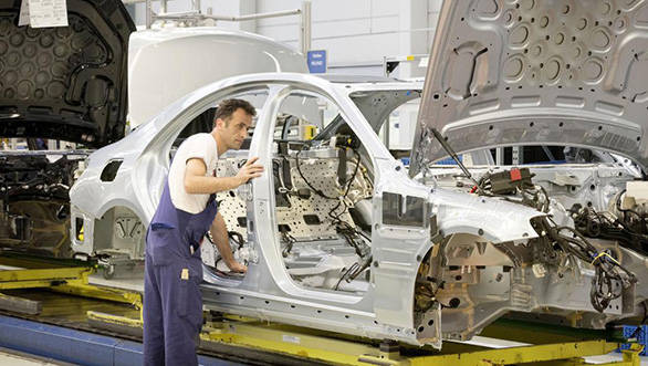 A worker working on the S-Class' body