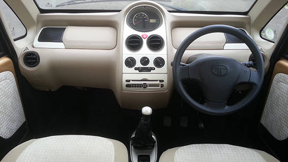 Note the bigger steering wheel, twin gloveboxes and speakers