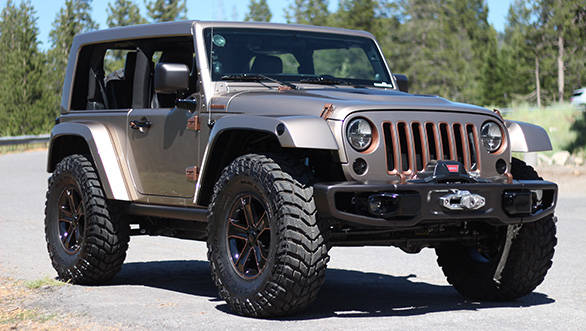 That sense of a low slung body on giant wheels is further bolstered by the removal of the B-pillar from the bodywork