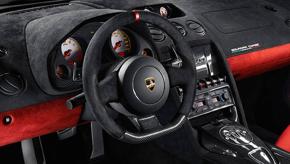On the inside, the Squadro Corse gets carbonfibre across the seats, middle console, door panels, part of the steering wheel, glove box, the door handles and panel trim
