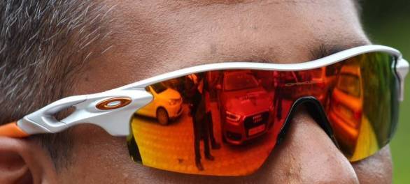 Our cars reflected in the polarised lenses of our Oakleys