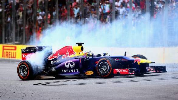 Sebastian Vettel celebrates his ninth consecutive F1 win with donuts at Interlagos