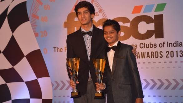 Krishnaraj Mahadik and Pradyumna Danigond receiving the awards for their karting title victories