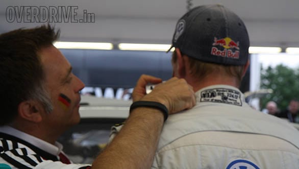 Volkswagen Motorsport boss Jost Capito giving Jari-Matti Latvala's face the German flag treatment