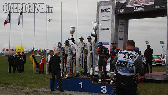 The podium at Mikolajki - Ogier and Ingrassia, Mikkelson and Ola Floene, Neuville and Nicolas Gilsoul
