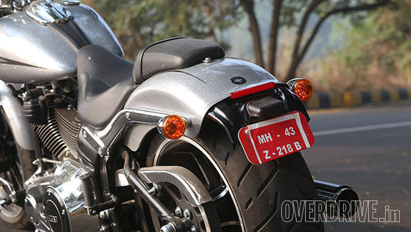 The rear-end is dominated by the 240-section rear tyre. Red bar above the number plate is actually a reflector. The indicators include the tail lamps