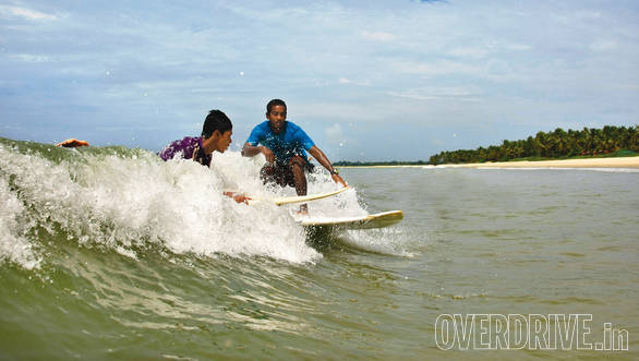 Ishita catches a nice wave as the sun goes down