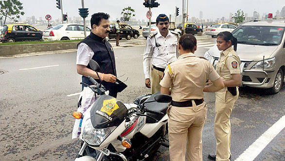 Transport Minister gets two constables fined for riding without a helmet Transport Minister fines cops