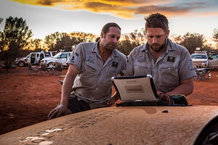 Stephan and Marvin, both part of the organizing team, looking up the next day's route