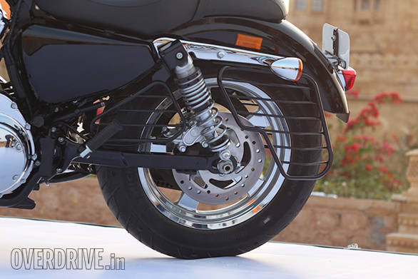 The Harley-Davidson 1200 Custom uses a box-section steel swingarm and twin rear shocks. The rear 16-inch tyre is a 150-section Michelin Scorcher