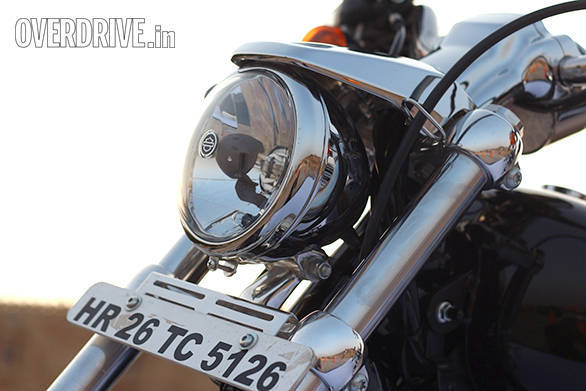 The small Harley-Davidson 1200 Custom head lamp looks good and projects a powerful beam. Not sure about the stylistic merit of the eyebrow that sits on top. 