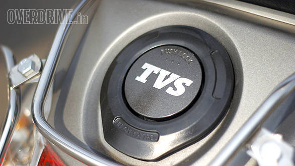 Both scooters have external fuel filler caps but the Hero's is covered and can be accessed via the ignition key slot while the TVS lid opens via the boot key slot