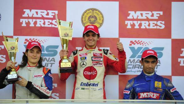 Fittipaldi, flanked by title rival Tatiana Calderon and Indian driver Tarun Reddy