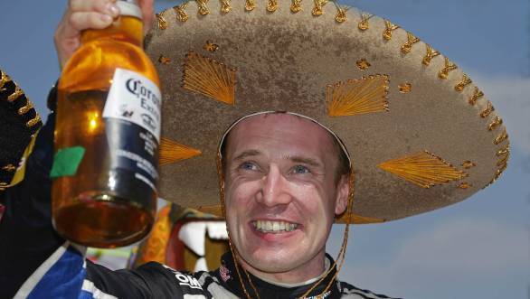 Latvala with a well-deserved cold one at the end of a dusty day's rallying