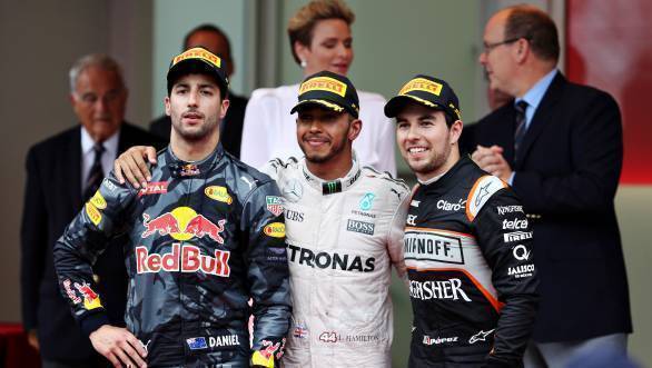 Lewis Hamilton, flanked by Daniel Ricciardo and Sergio Perez on the podium of the 2016 Monaco GP