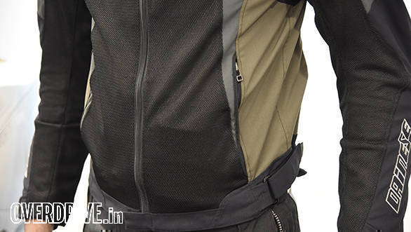 Waist adjusters fine-tune fit. The jacket sits so snug that putting anything in the pockets creates an unsightly bulge