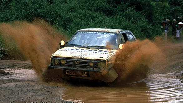 Eriksson and co-driver Peter Diekmann at the Ivory Coast Rally in September 1987, splashing through the stage in their Volkswagen Golf GTI