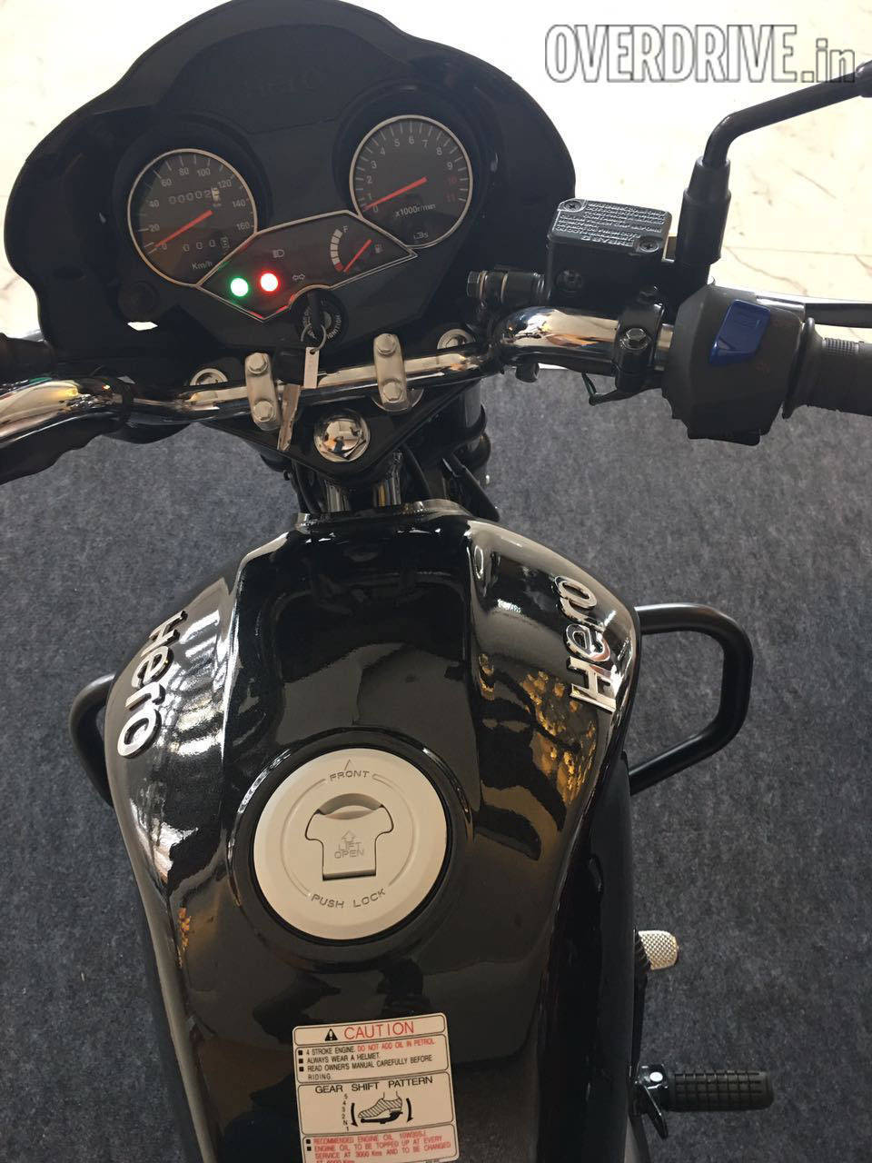 Look familiar? The blue switch turns on Hero's start-stop gizmoid, i3S. When you stop and shift to neutral, it'll turn the engine off and restart it when pull the clutch in.
