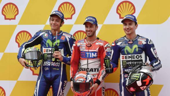 Ducati's Andrea Dovizioso, flanked by Yamaha riders Valentino Rossi and Jorge Lorenzo