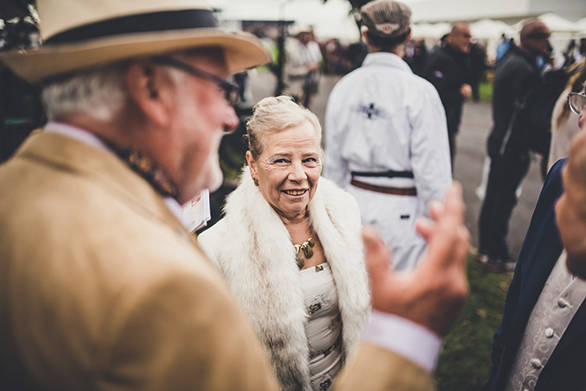 The celebration wouldn't be complete without the quintessential period costumes reliving the '60s and '70s  it's like being inside a classic motorsport movie