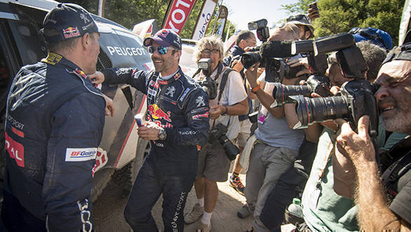 Dakar 2017: Sebastian Loeb wins Stage 11 to keep title hopes alive Sebastien Loeb and Stephane Peterhansel of Team Peugeot TOTAL seen surrounded by media after stage 11 of Rally Dakar 2017 from San Juan to Rio Cuarto, Argentina on January 13, 2017. // Marc Bow/Red Bull Content Pool // P-20170113-01724 // Usage for editorial use only // Please go to www.redbullcontentpool.com for further information. //