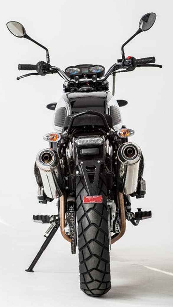 Notice the dual chrome exhaust pipes with knobby 140/80R17 tyres of the  2017 Jawa 660 Vintage